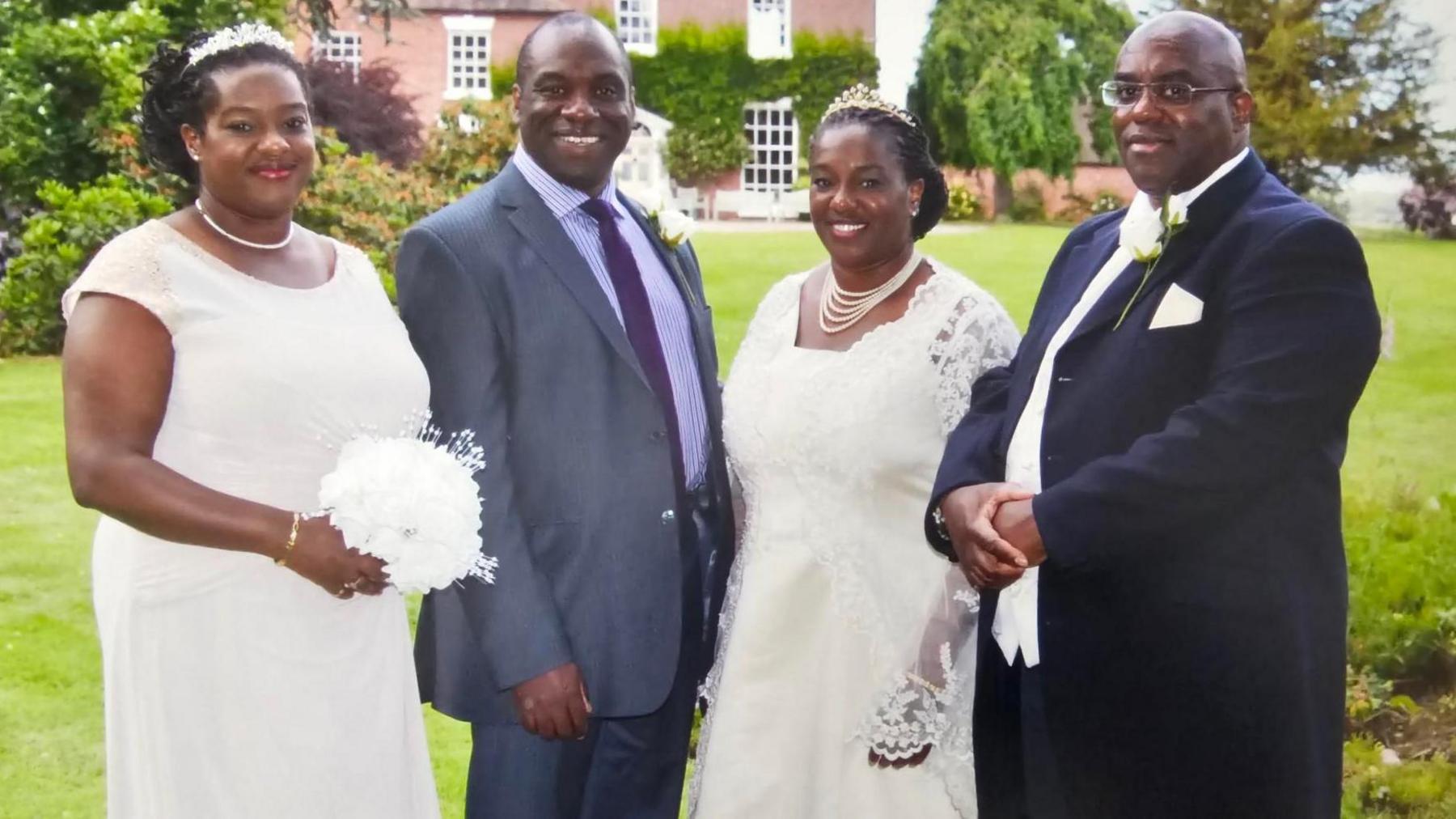 Four siblings at a wedding