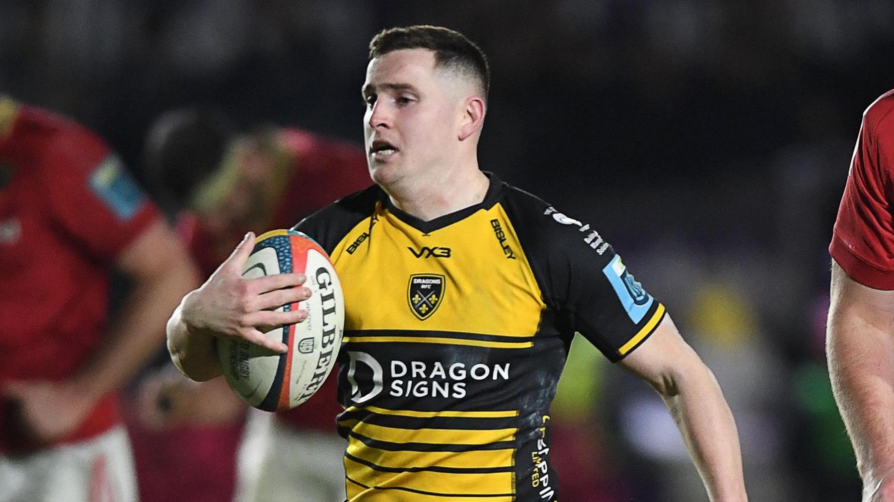 Dane Blacker on his way to scoring a try for Dragons