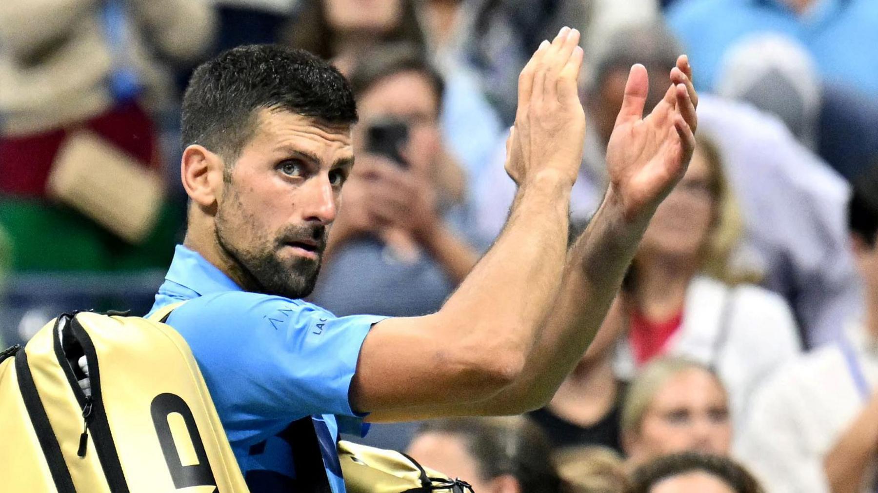 Novak Djokovic claps to the crowd at the 2024 US Open