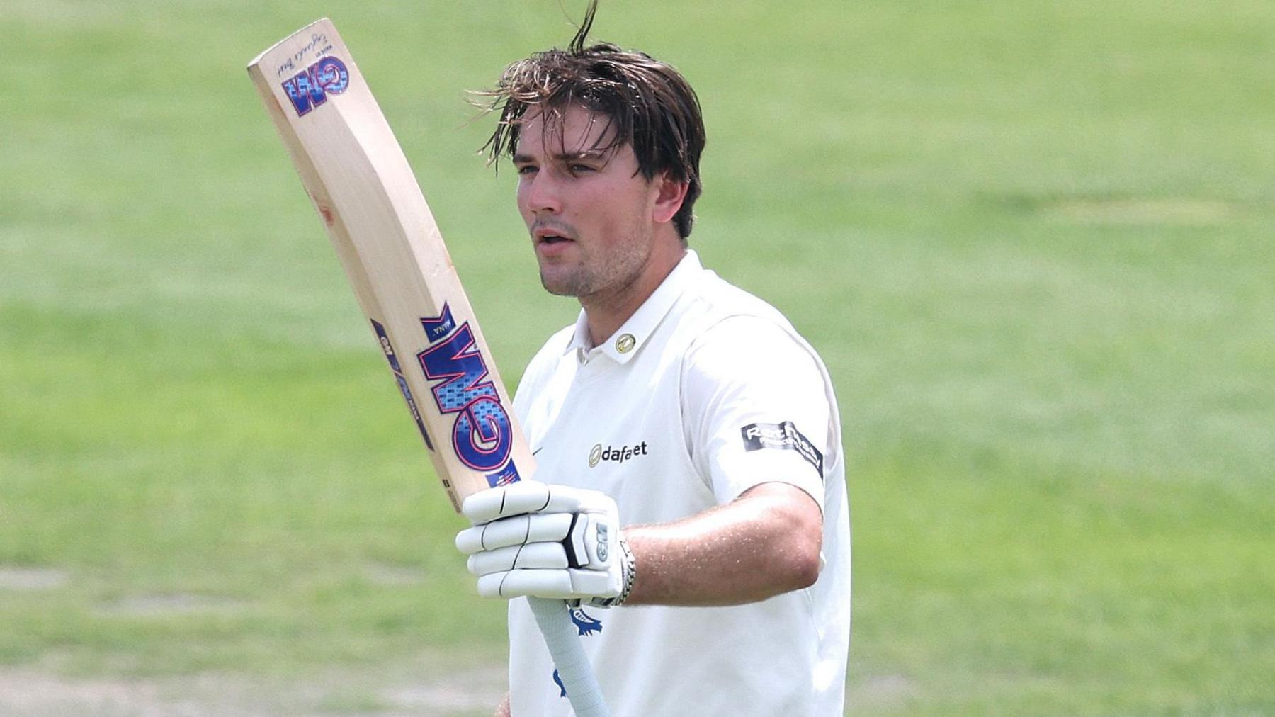 James Coles acknowledges his century for Sussex against Warwickshire