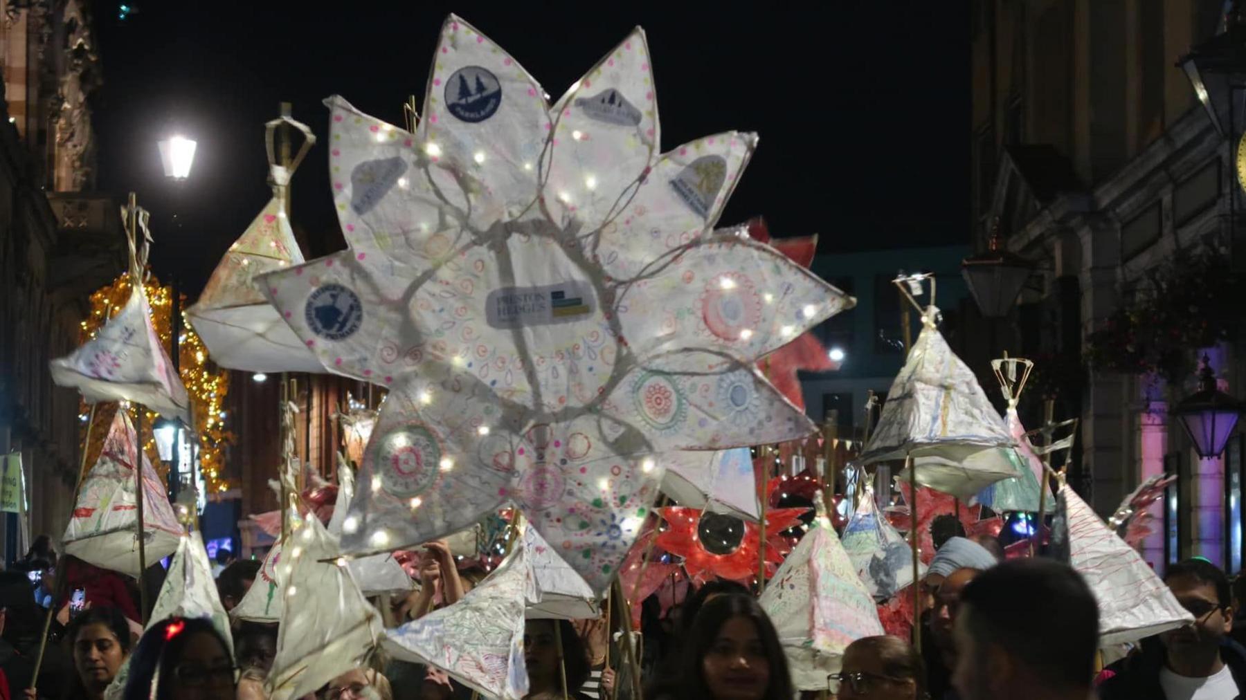 Home-made laterns and decorations are taken along Northampton's streets in the dark during Diwali celebrations on 26 October 2024.