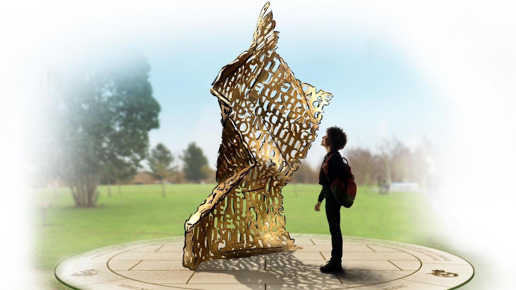 Artists' impression of a sculpture, showing a golden artwork resembling a crumpled letter with wording embossed 