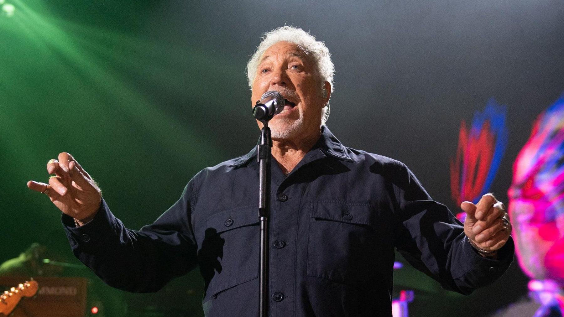 Tom Jones on stage singing