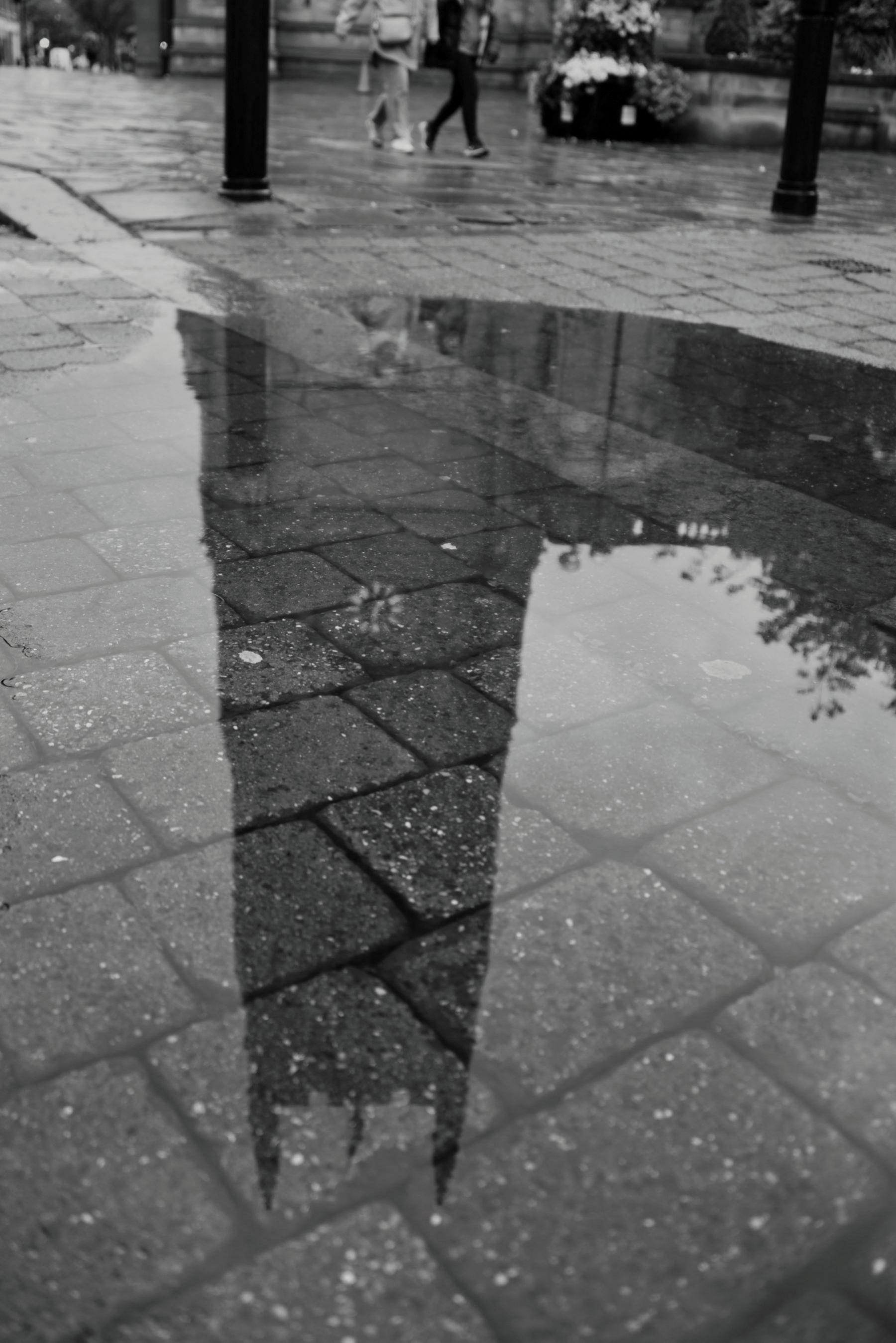 A photograph of a reflection of Derby Cathedral taken in a puddle 