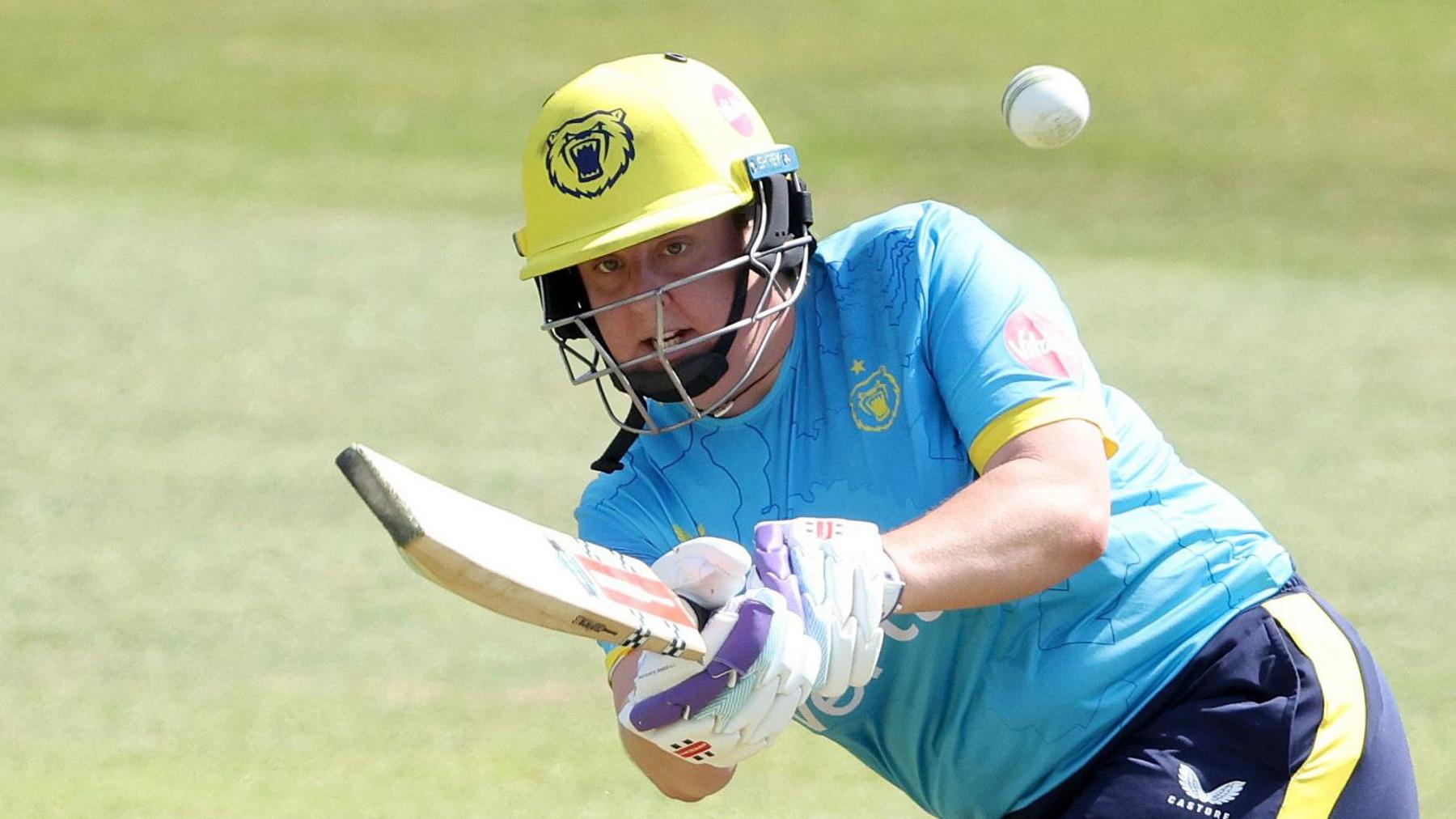 Warwickshire's Abbey Freeborn plays a shot
