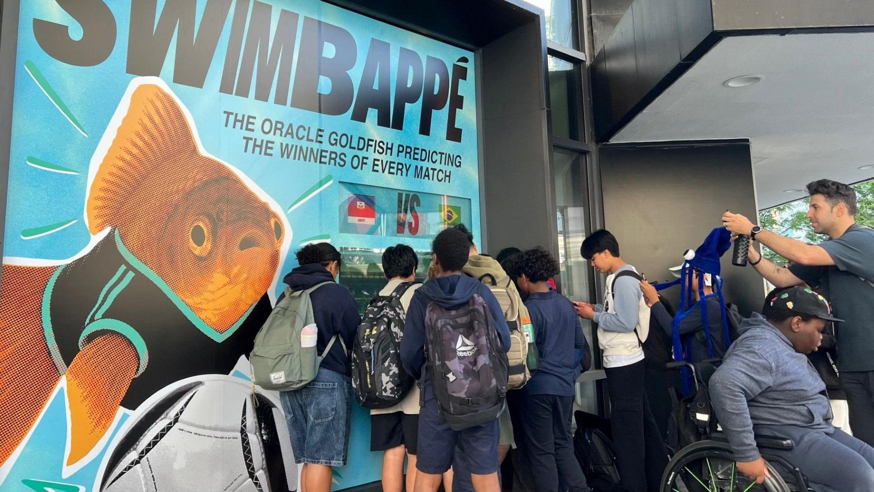 Swimbappé makes daily predictions from his tank in Toronto