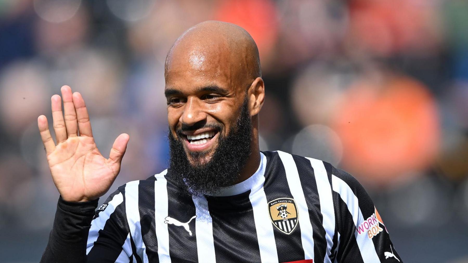 David McGoldrick looks for a high-five after scoring a goal for Notts County