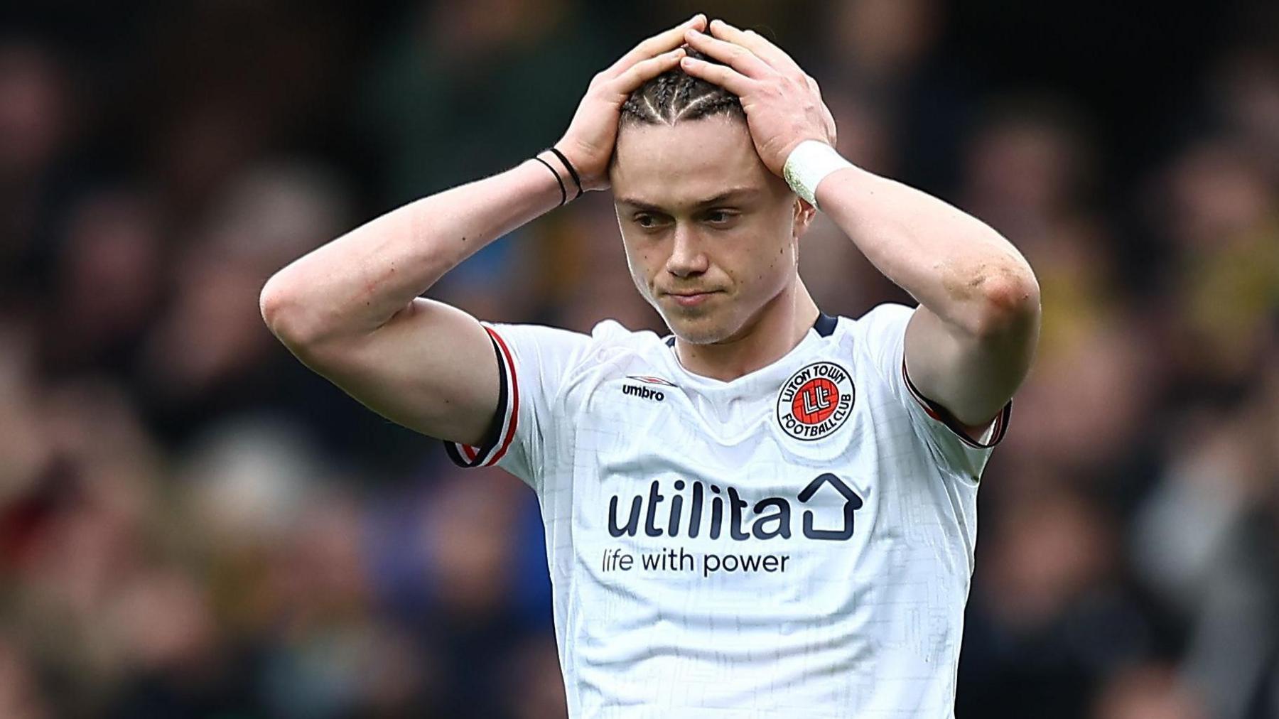 Luton Town's Thelo Aasgaard puts his hands on top of his head following their defeat by Watford