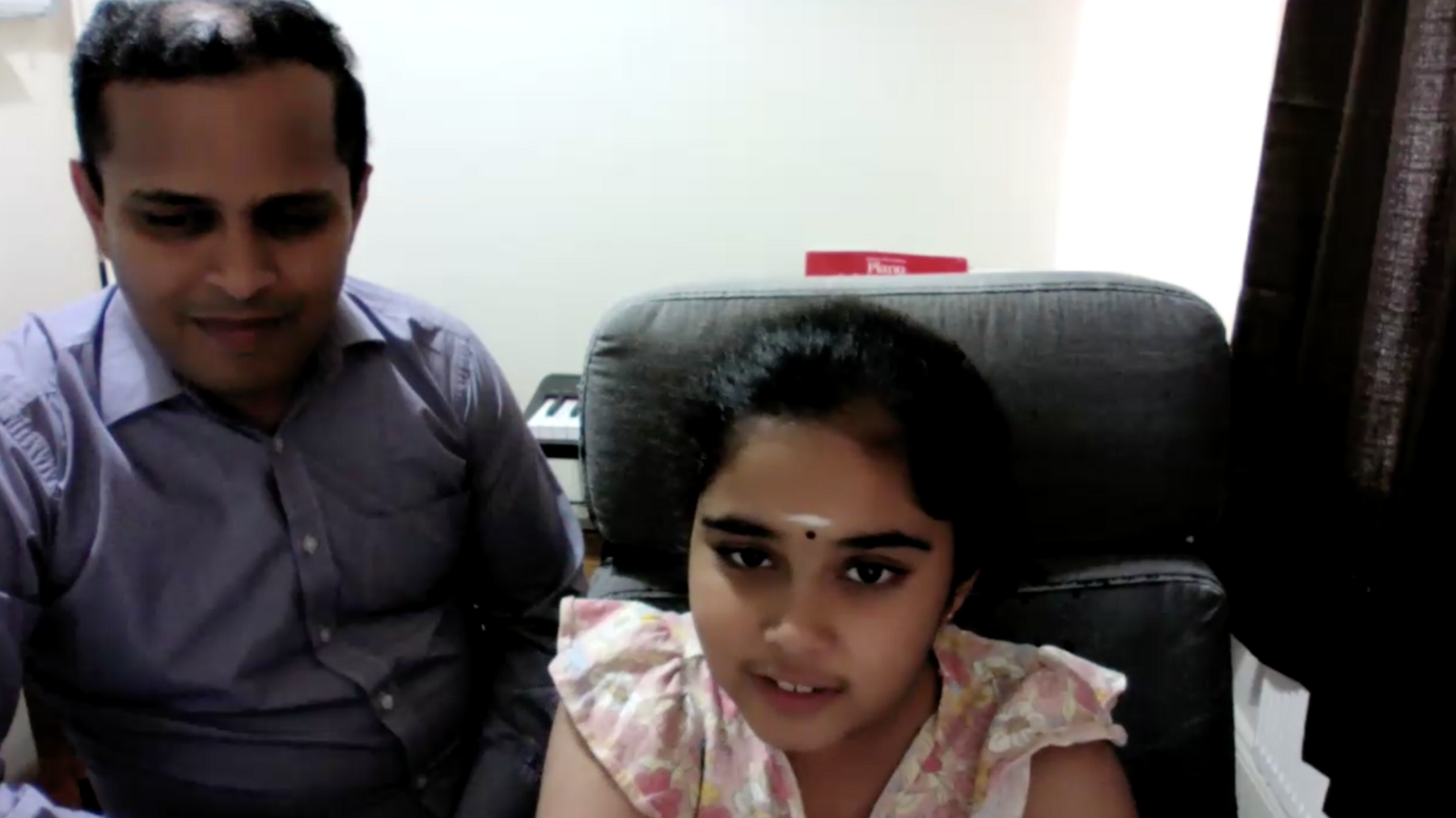 Bodhana Sivanandan with her father during a Zoom call with the BBC