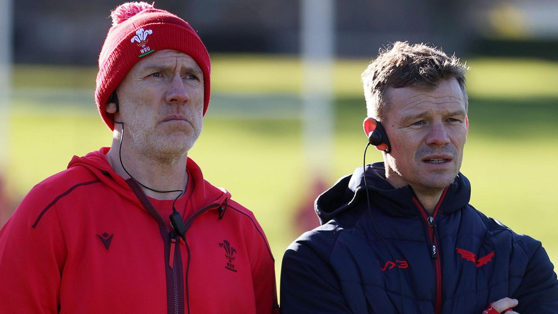 Wales boss Steve Tandy and Scarlets head coach Dwayne Peel watch training