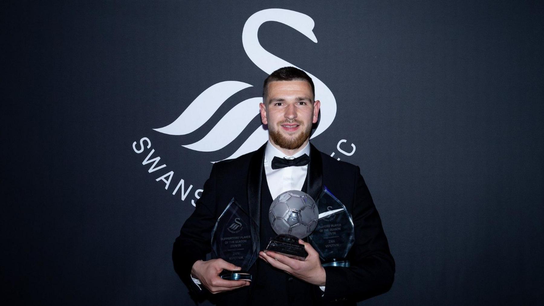 Zan Vipotnik with his three trophies