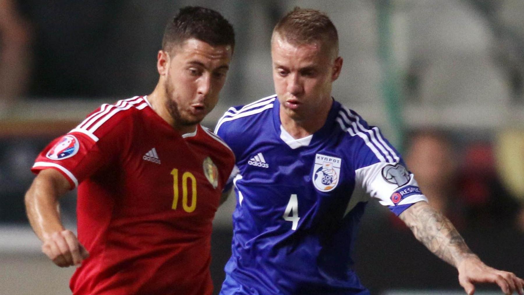 Jason Demetriou of Cyprus challenges Eden Hazard of Belgium