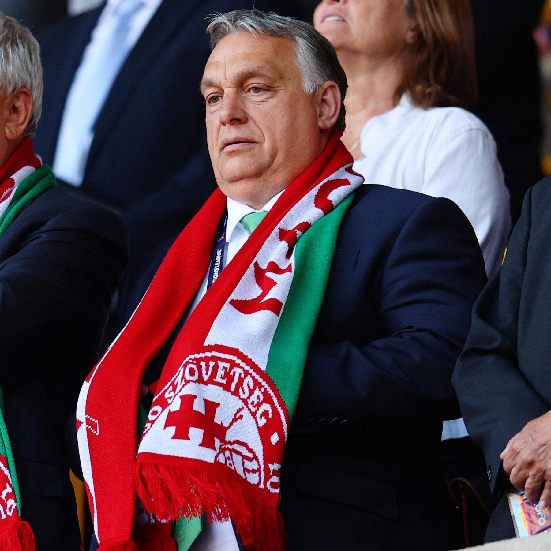 Viktor Orban wearing a Hungarian scarf in the stands