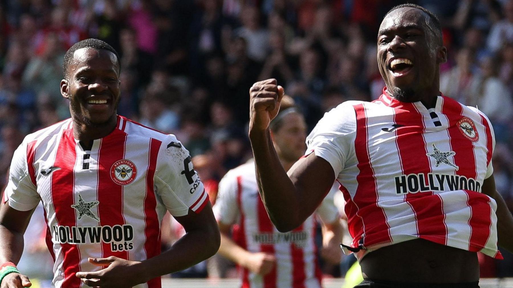 Michael Kayode celebrates