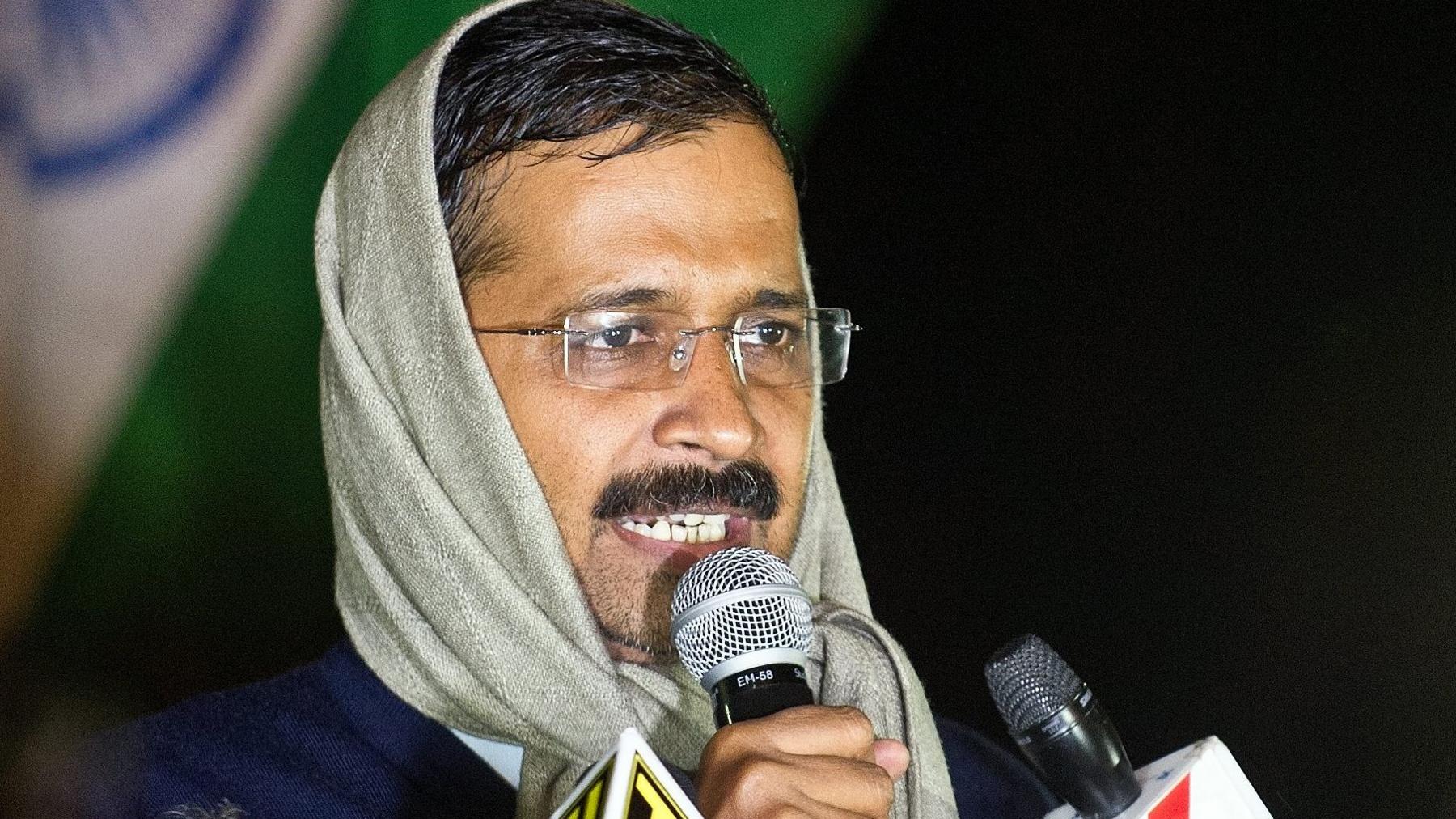 Delhi's Chief Minister Arvind Kejriwal talking to journalists at his sit-in on 21 January