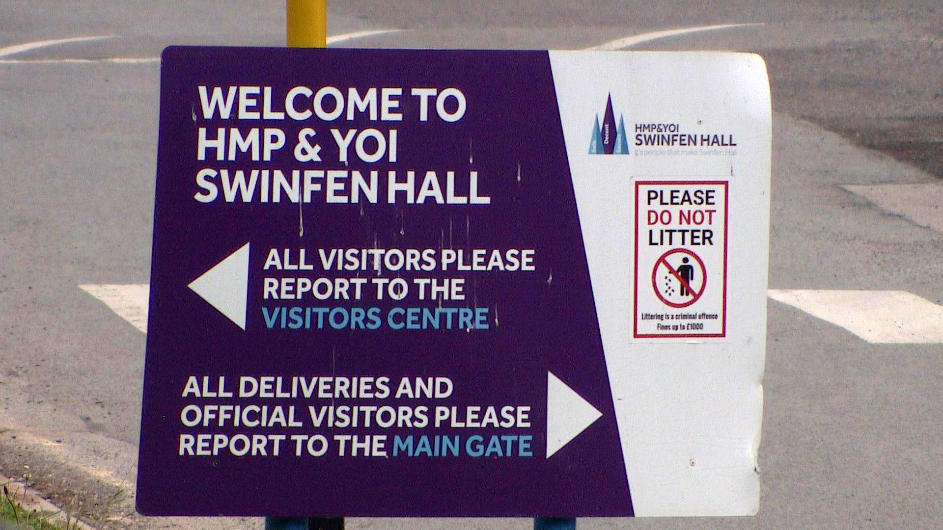 An entrance sign at Swinfen Hall prison. It welcomes people to HMP and YOI Swinfen Hall. All visitors are asked to report to the visitors centre while deliveries are sent elsewhere