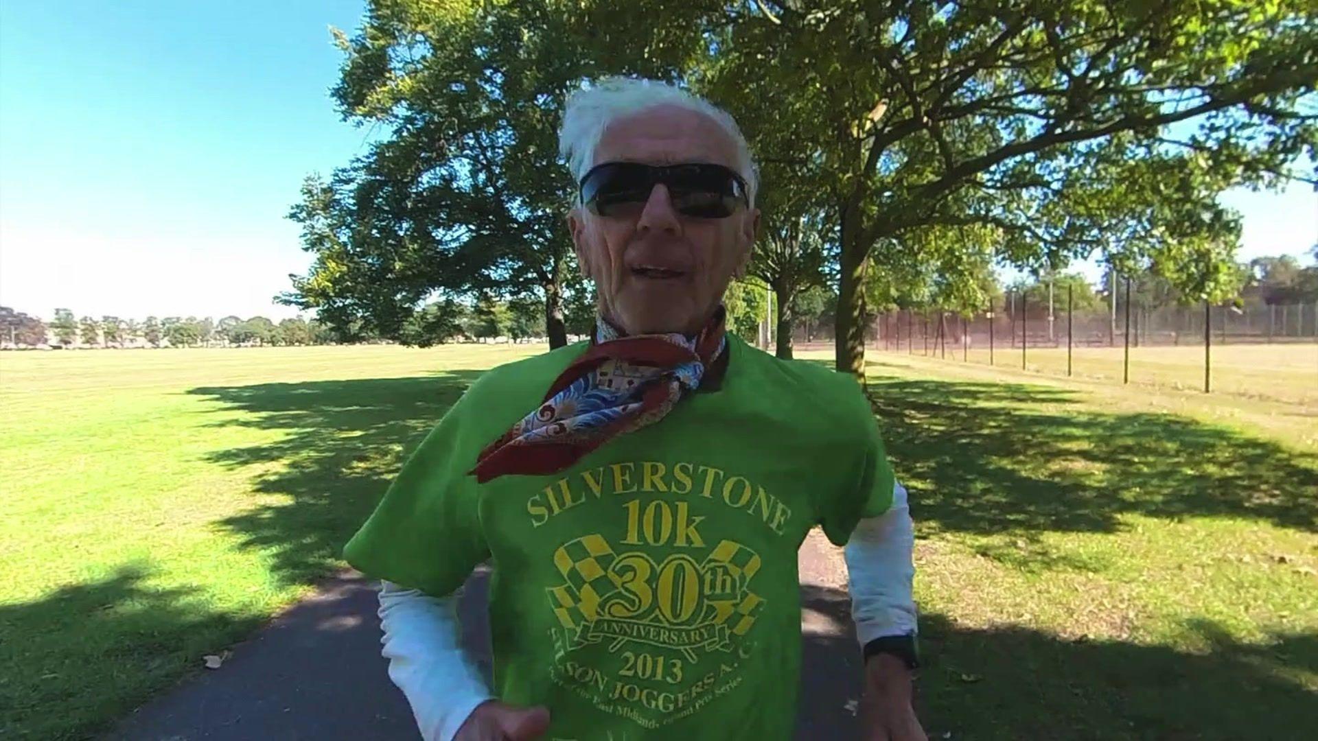 Bob Emmerson is captured jogging in a park, wearing sunglasses and a green T-shirt