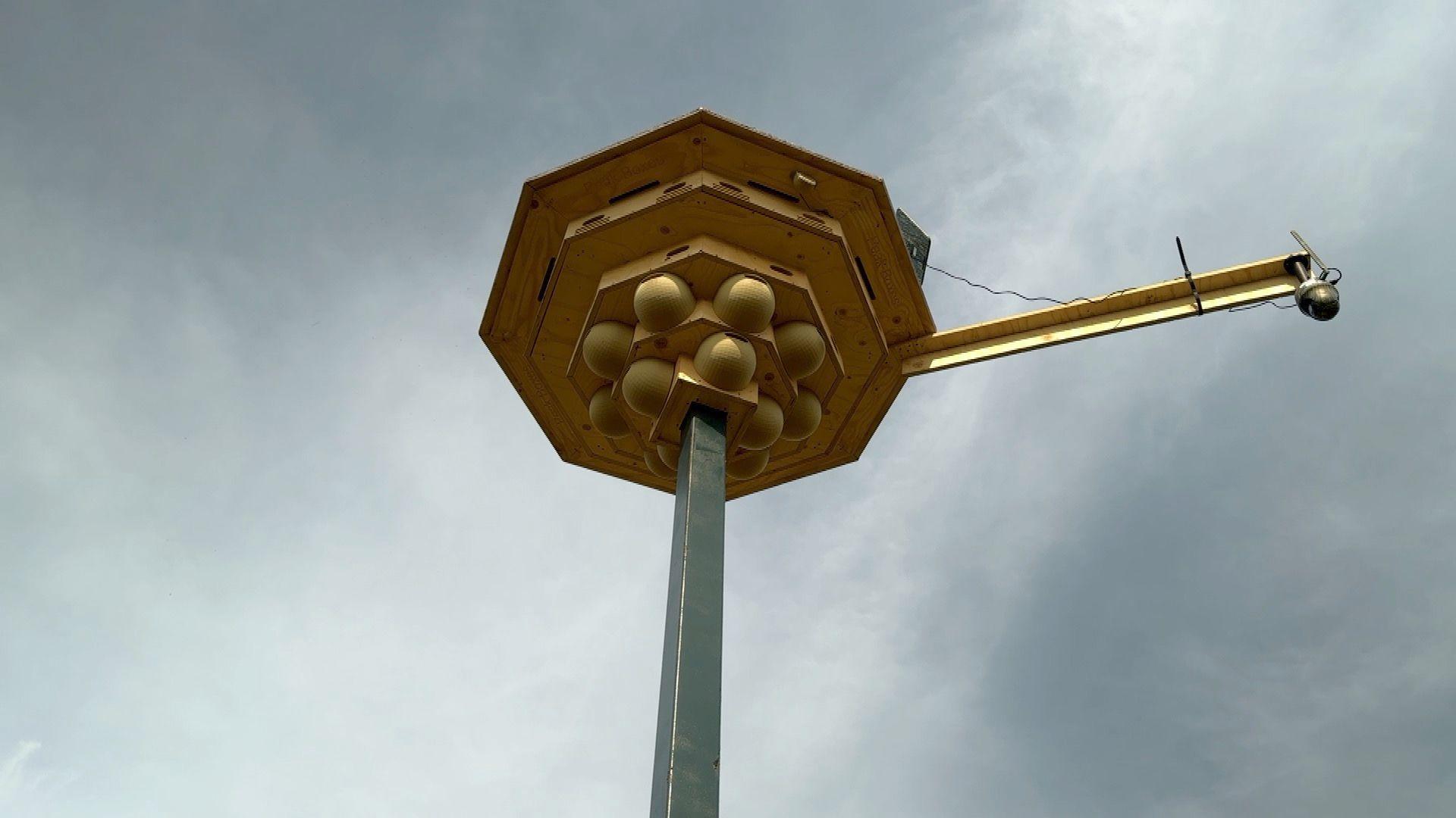A swift tower as seen from below. The tower consists of 23 swift boxes made of plywood and 12 house martin cups.