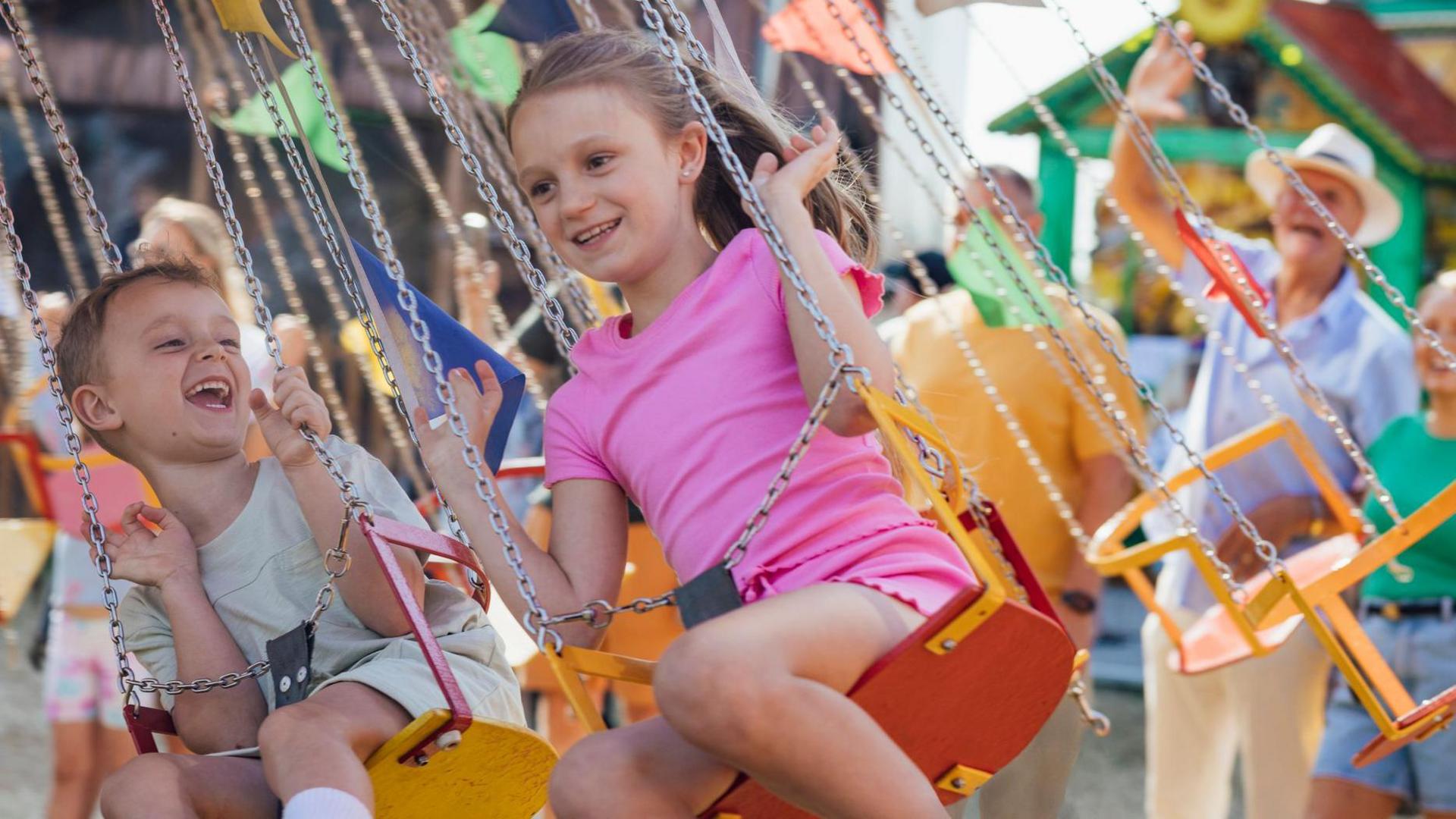 Children on fairground ride.