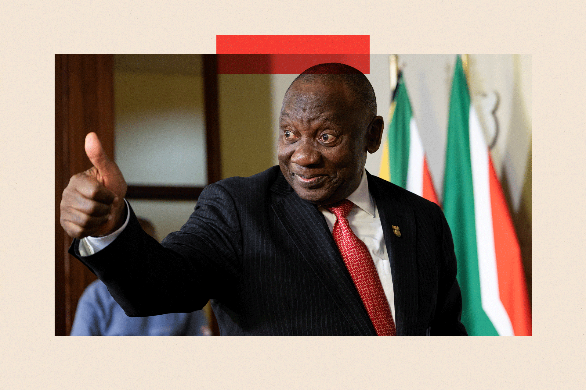 South Africa's President Cyril Ramaphosa puts his thumbs up to a journalist after a media briefing