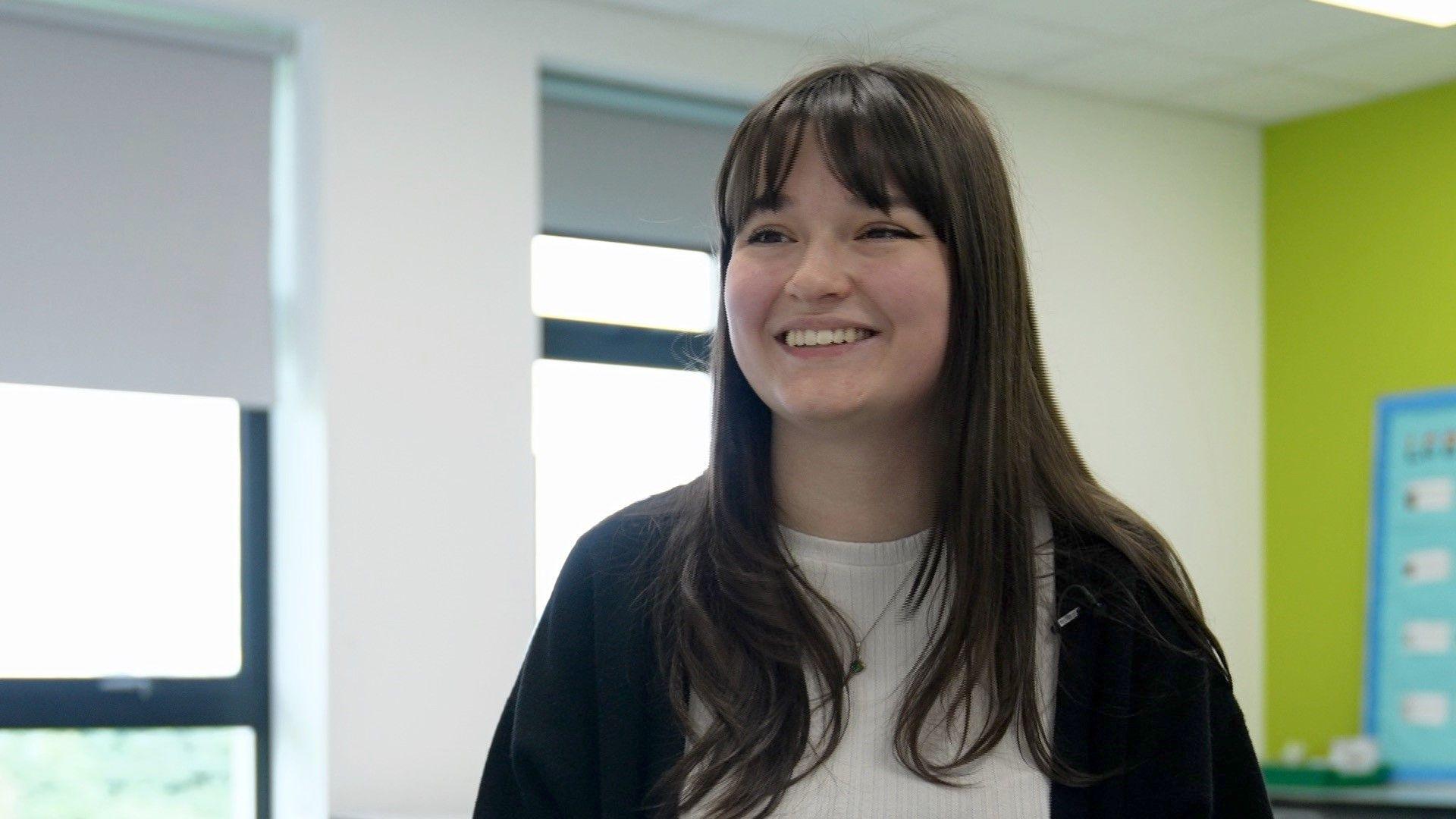 Science teacher Alison Turner smiles to the side of the camera