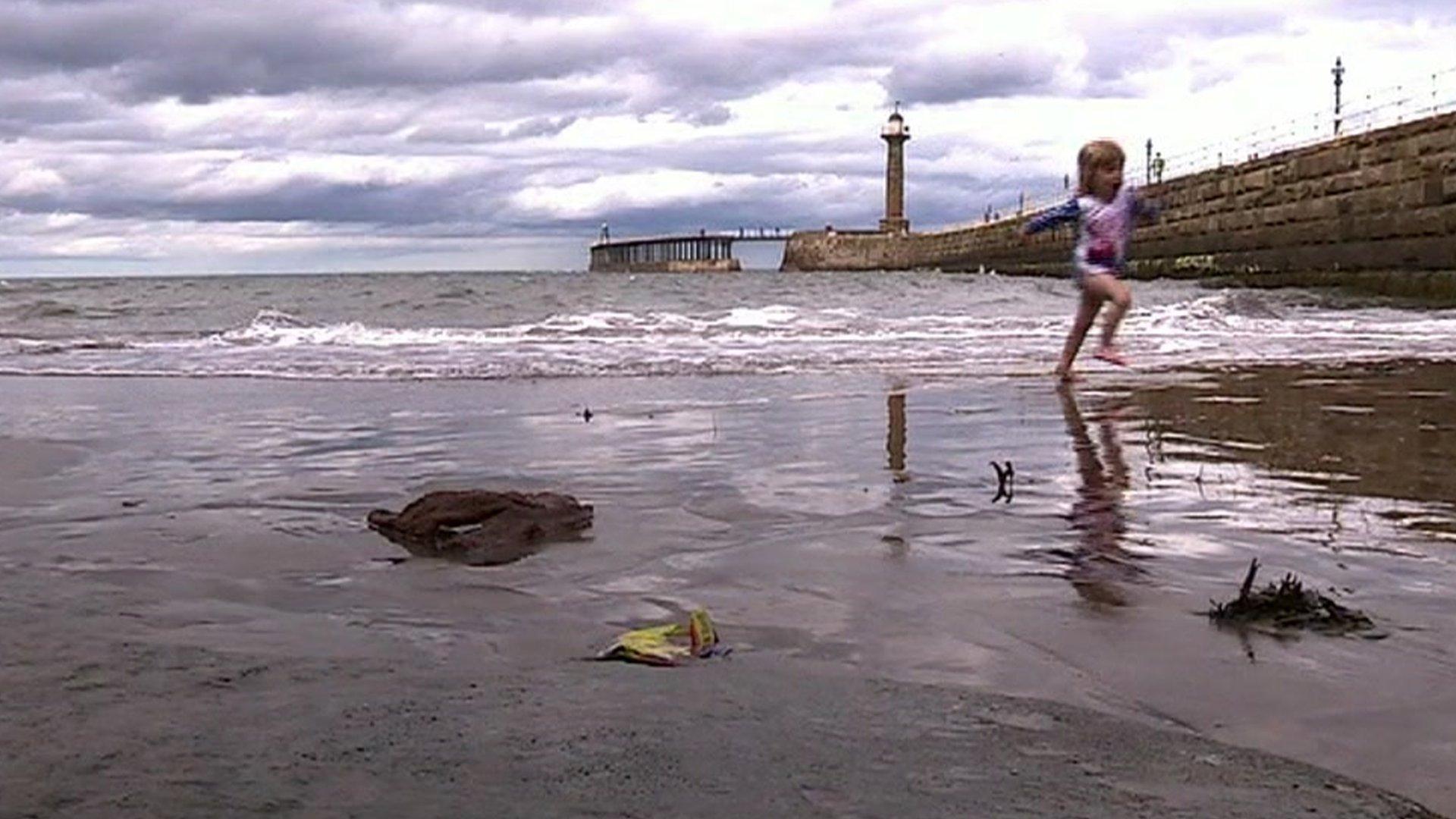 Child playing on sand