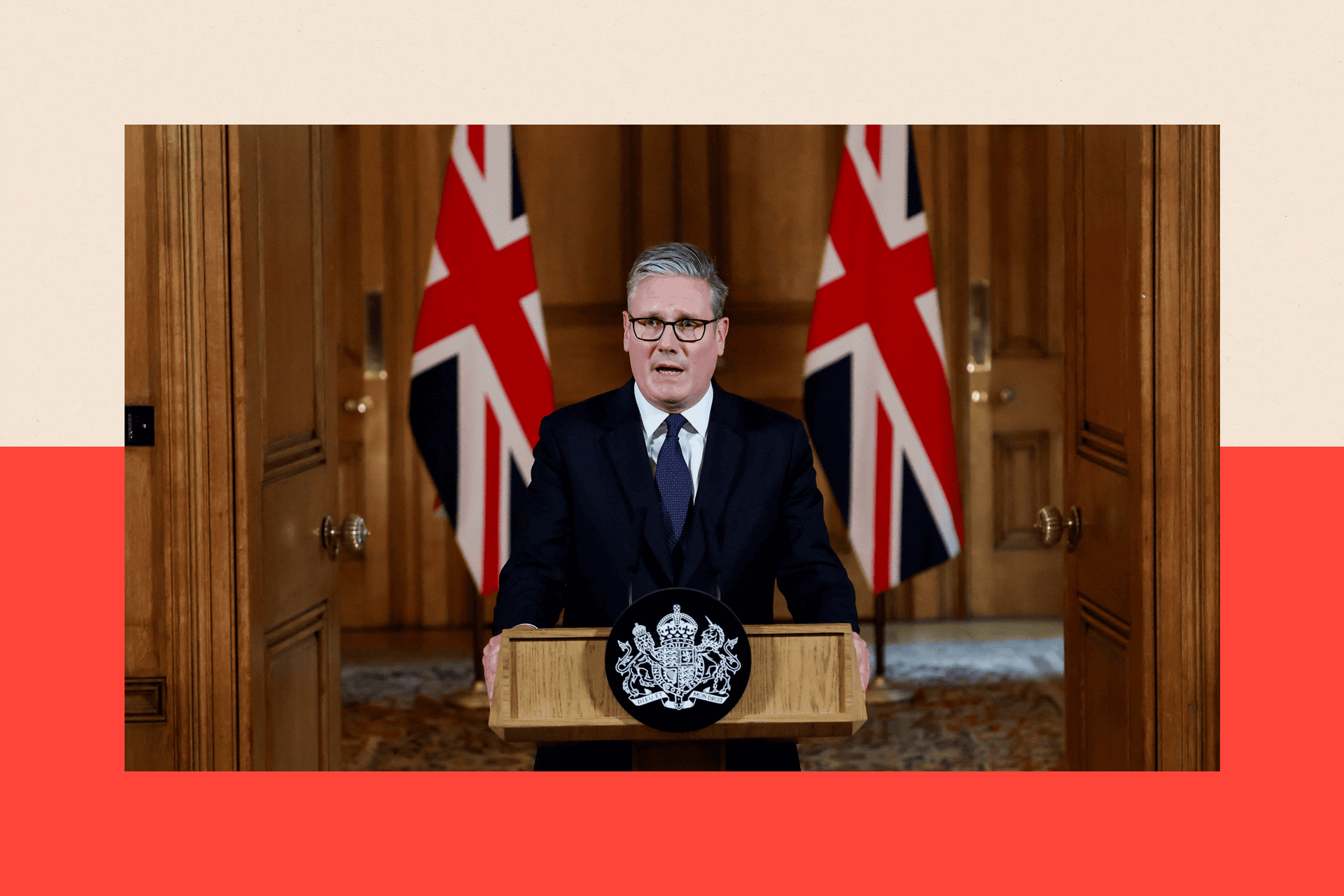 Keir Starmer delivers a statement inside No 10 Downing Street, standing at a lectern in front of two flags