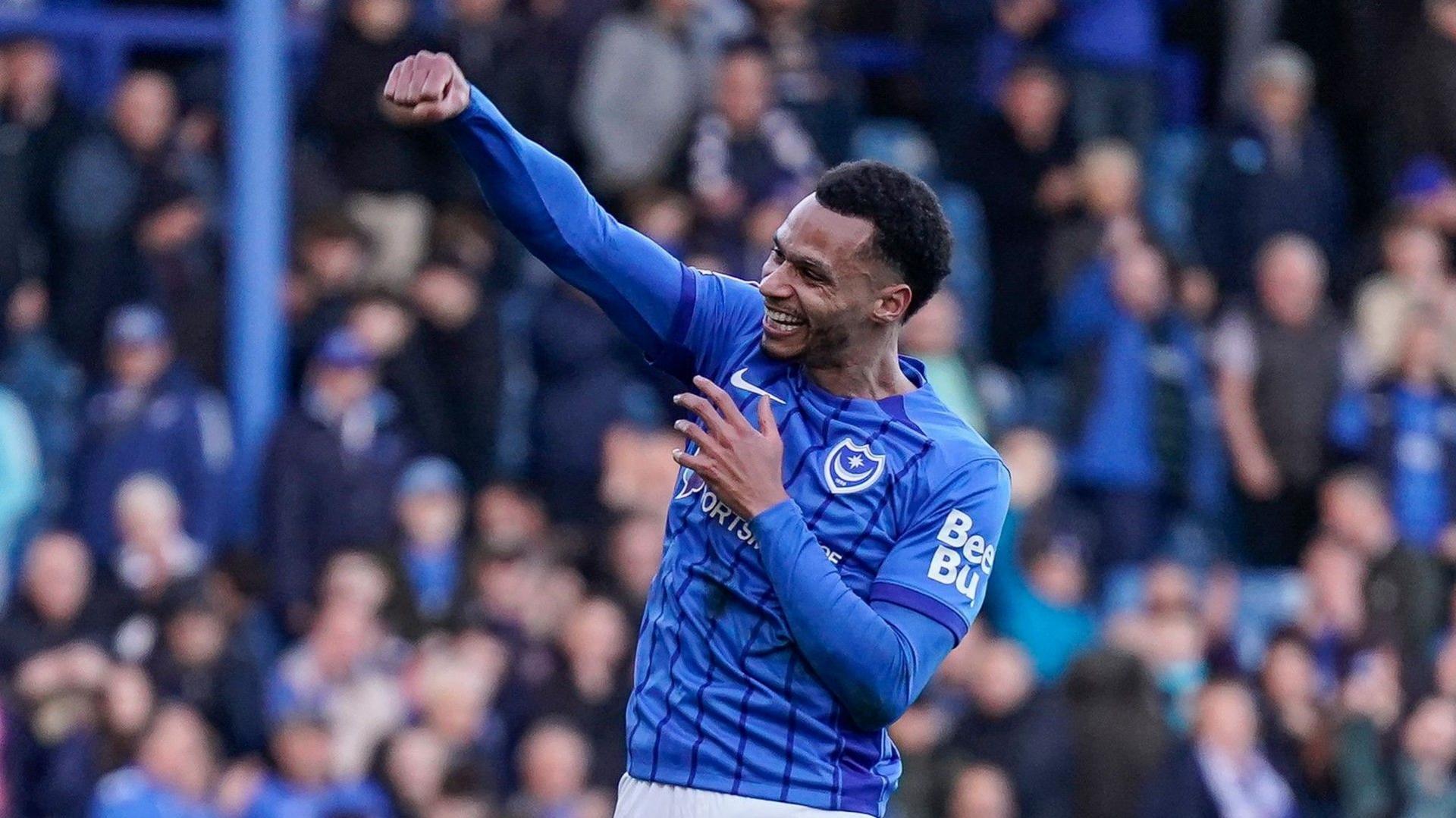 Josh Murphy punches the air with his right hand after opening the scoring in Portsmouth's 2-1 win over Queen's Park Rangers at Fratton Park