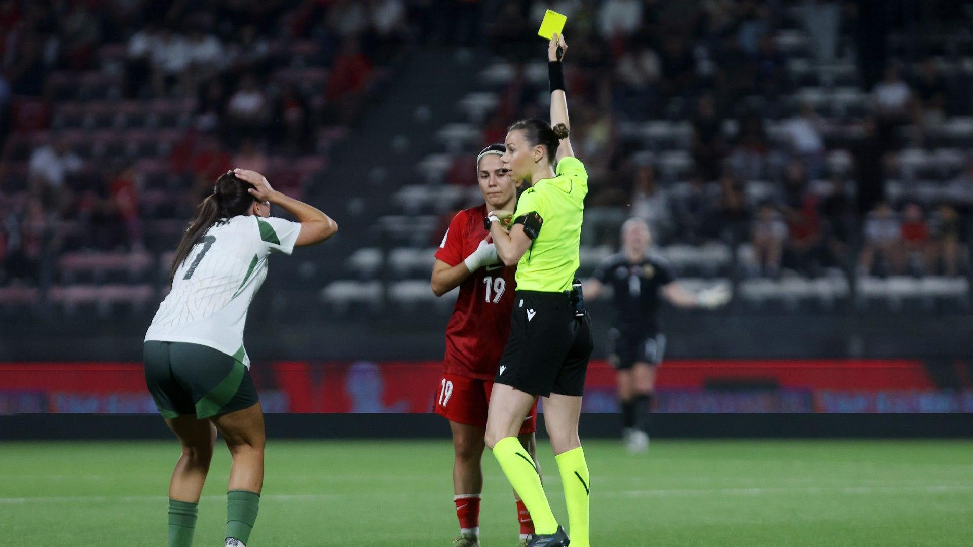 Ellie Mason puts her hands to her head when Busem Seker is only shown a yellow card