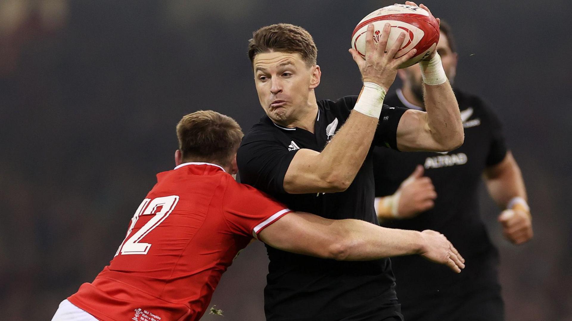 Beauden Barrett of New Zealand is tackled by Nick Tompkins of Wales