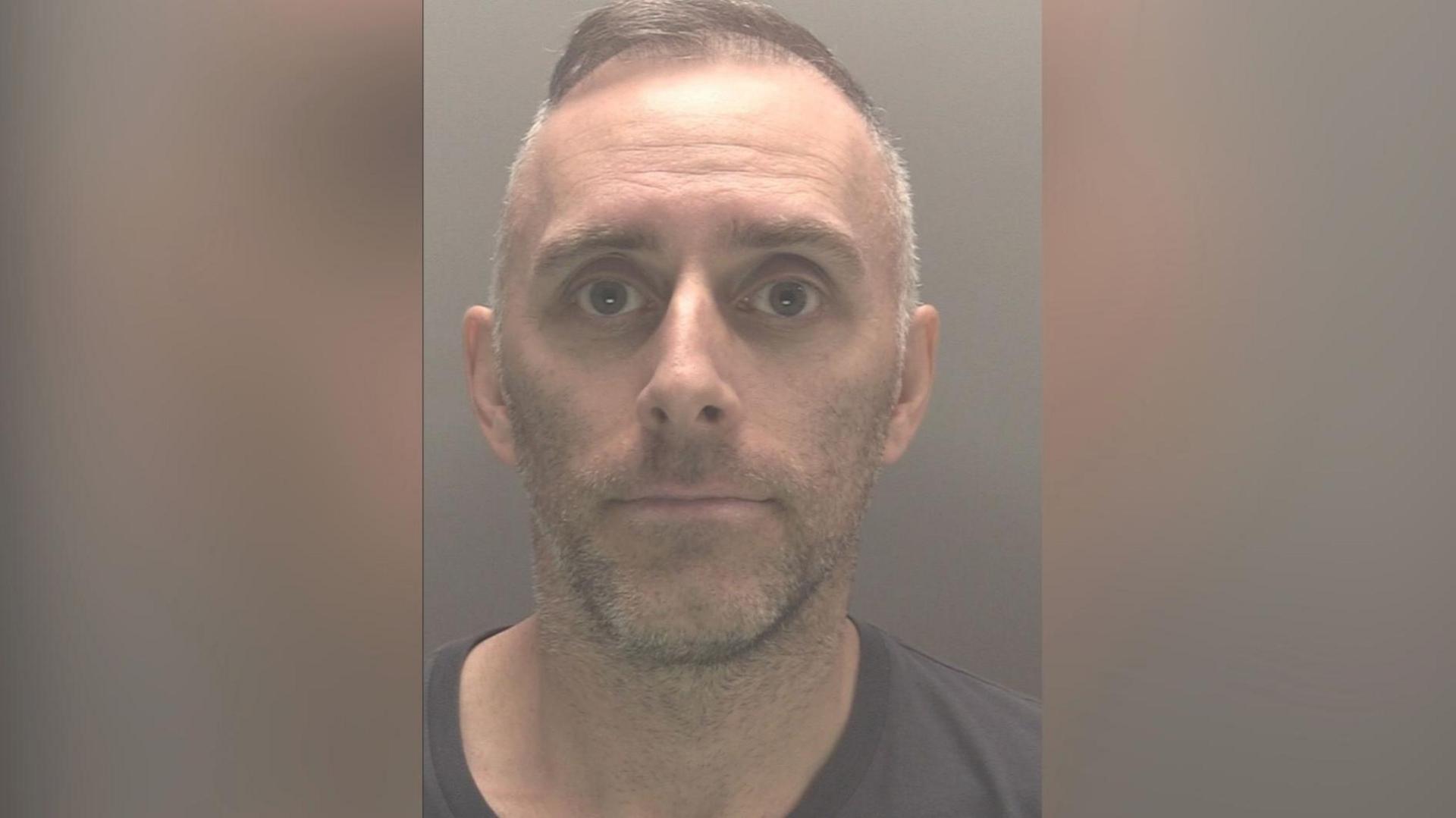 A mugshot of Scott Cameron 
