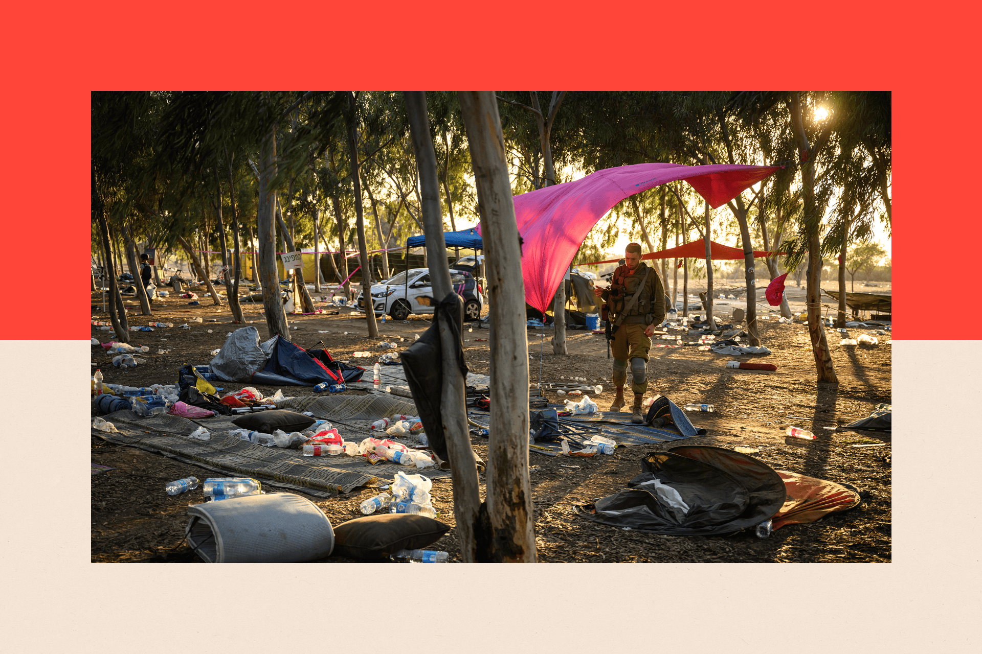 Members of the security forces search for identification and personal effects at the Supernova Music Festival site, where hundreds were killed