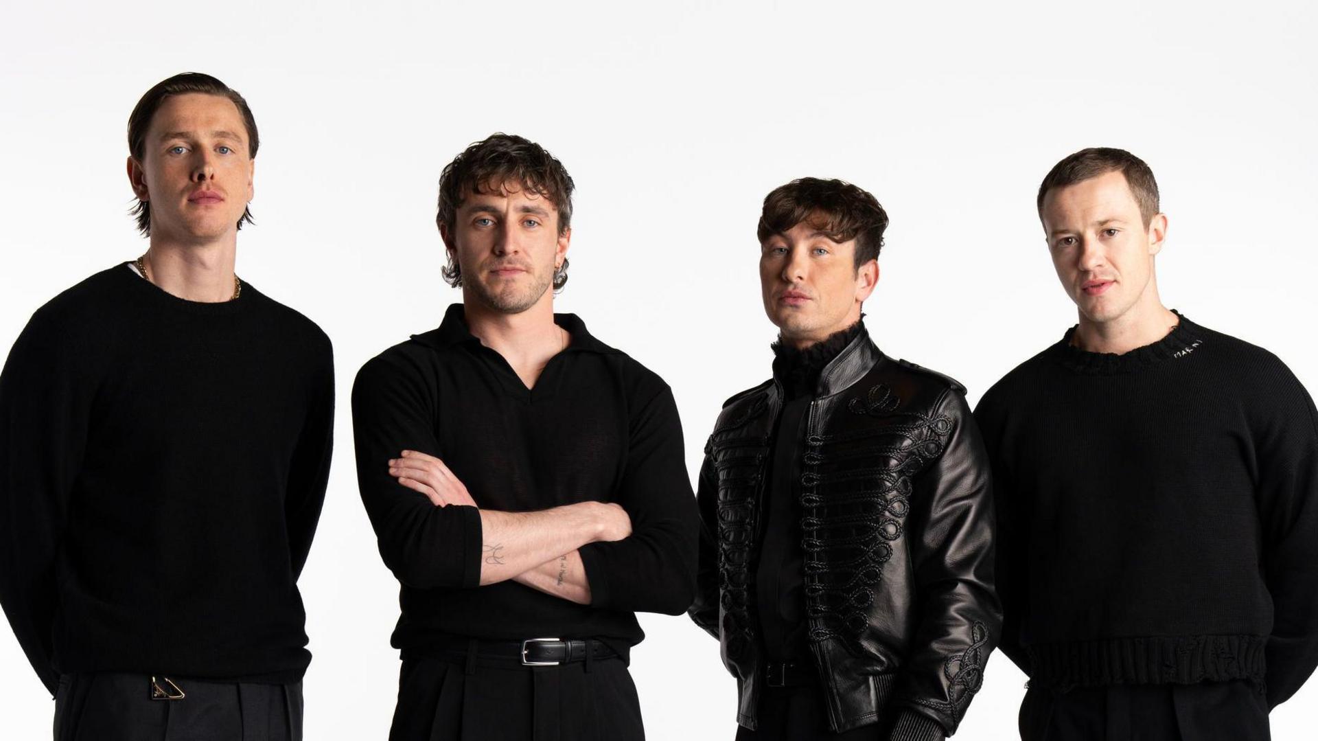 Harris Dickinson as John Lennon, Paul Mescal as Paul McCartney, Barry Keoghan as Ringo Starr, and Joseph Quinn as George Harrison. All are wearing black tops.