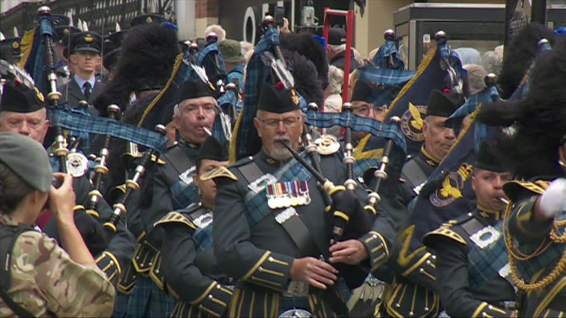 RAF personnel playing bagpipes during a parade through Lincoln city centre