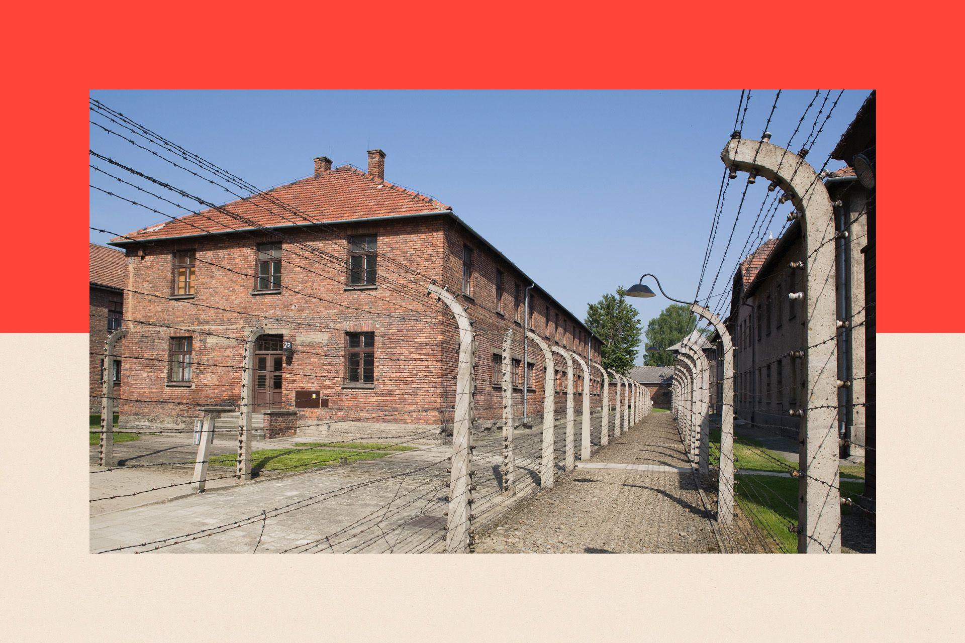 One prison block and double line of electric fencing at Auschwitz Concentration Camp in Poland