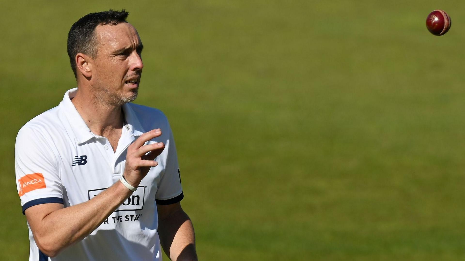 Hampshire's Kyle Abbott prepares to catch a cricket ball