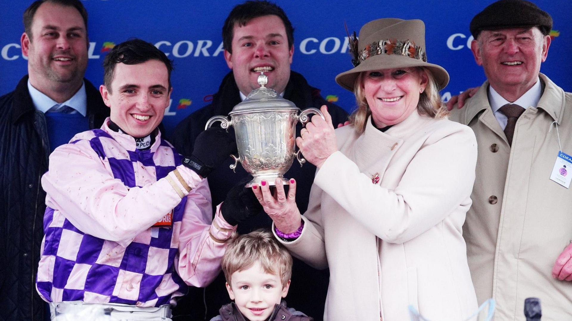 Mel Rowley and winning jockey Charlie Hammond get their hands on the Welsh Grand National trophy