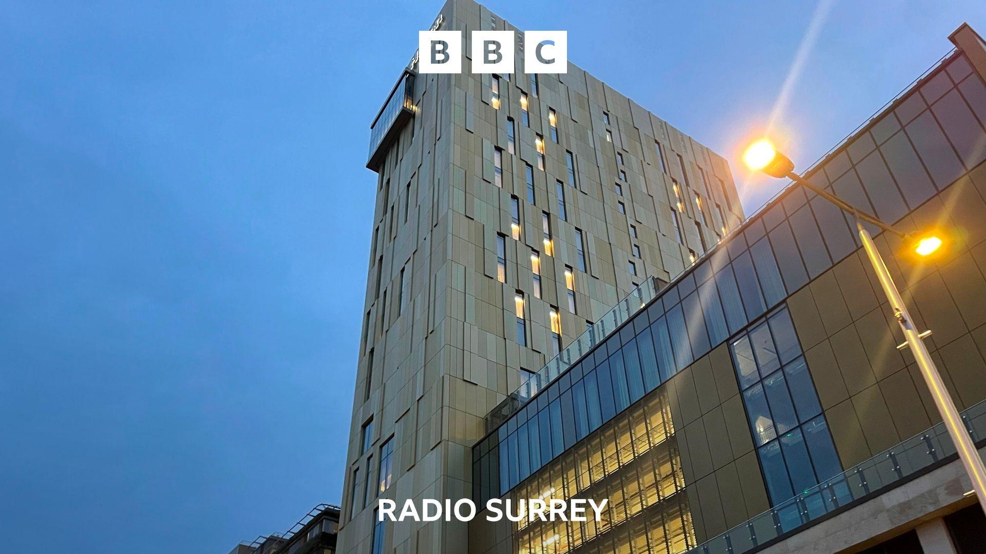 A cream clad tower block at dawn.