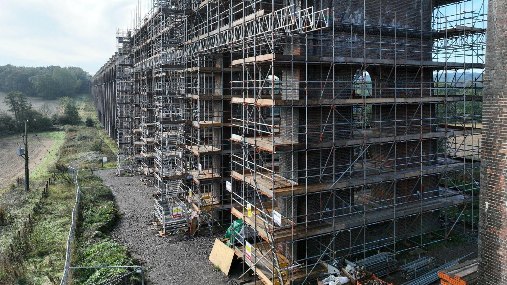 Scaffolding surround arches of the viaduct