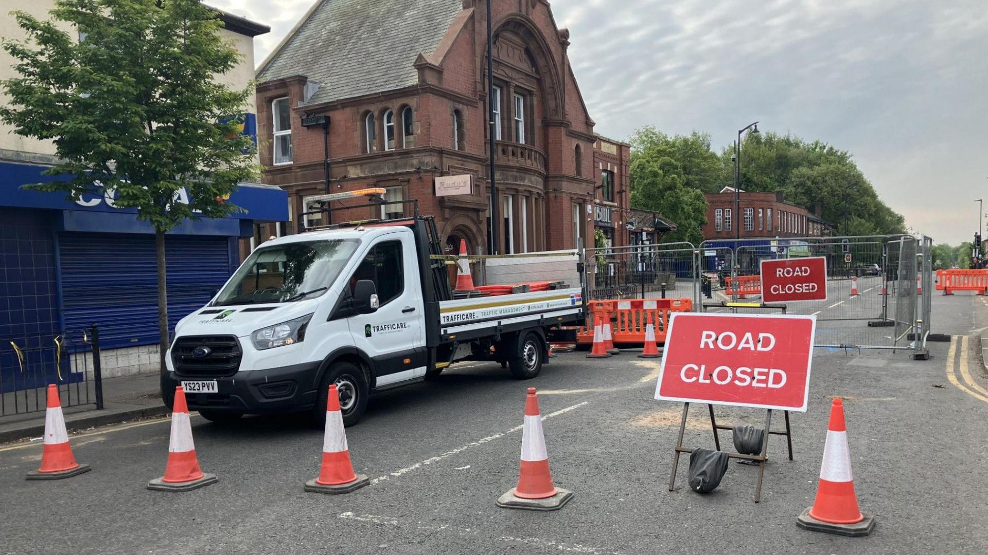 Bury New Road is sealed off with cones, and barriers