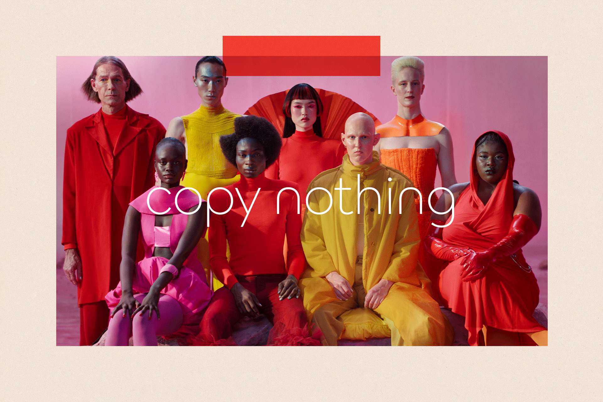 A still from Jaguar's relaunch campaign featuring eight models in bright clothing and the slogan: "copy nothing"