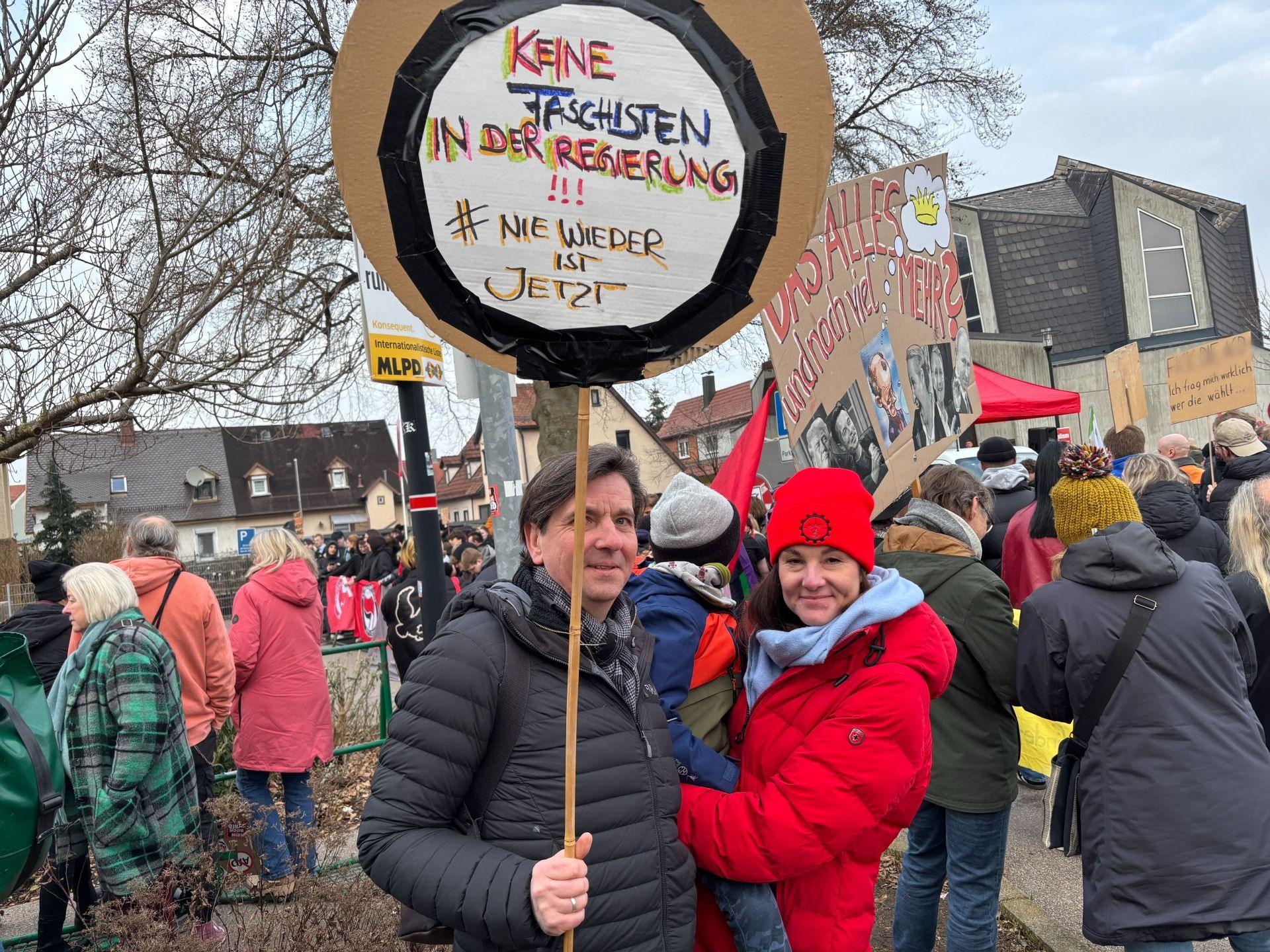 People hold a banner at an anti-AfD demonstration in Heidenheim