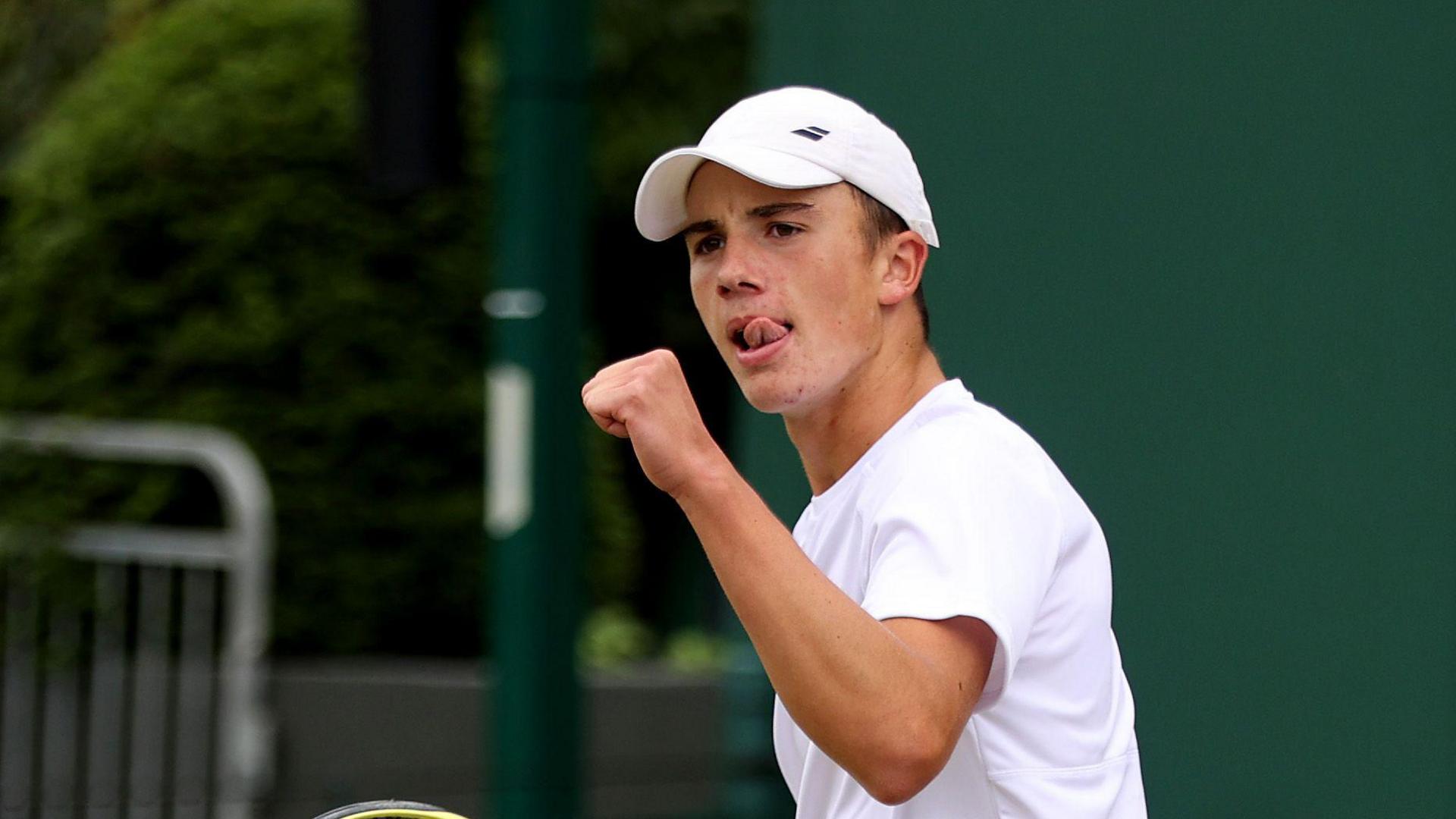 Oliver Tarvet celebrates victory in the third round of Wimbledon qualifying