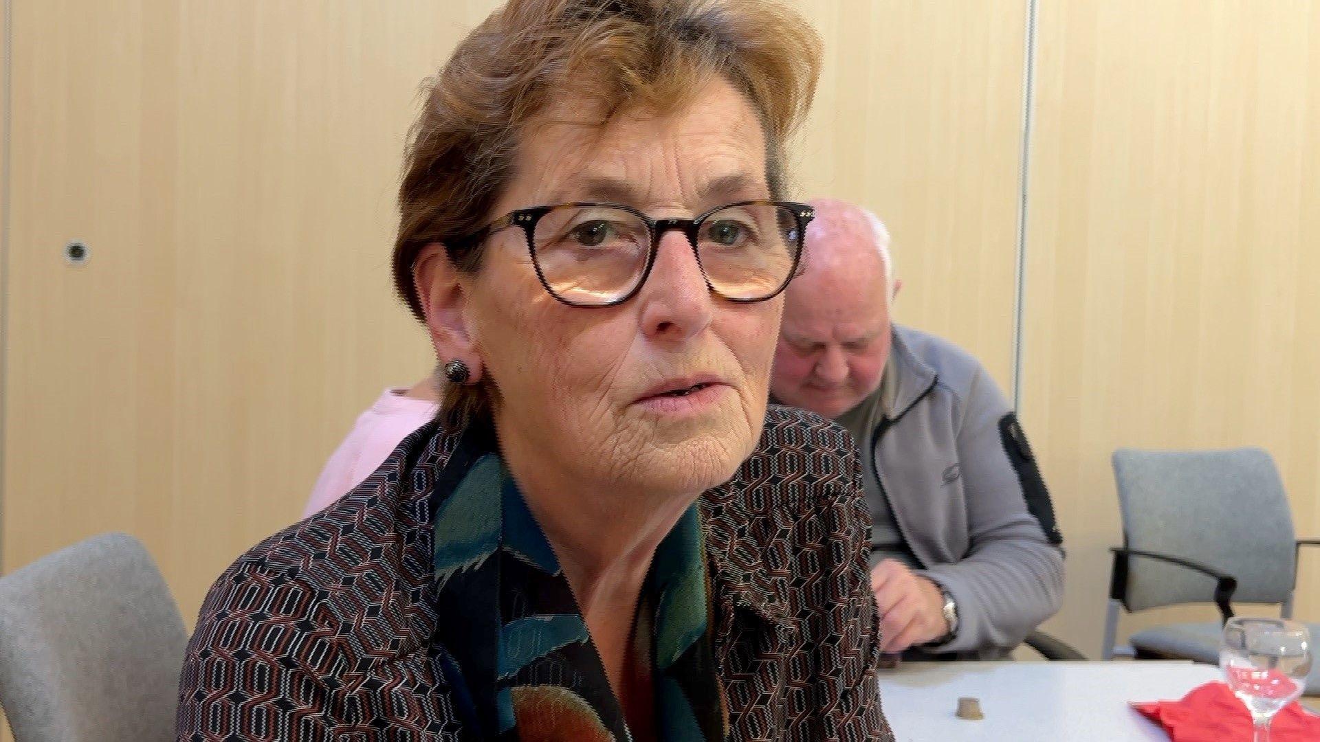 Mary Leighton sits at a table at a weekly snack and chat event for pensioners in Worcester.