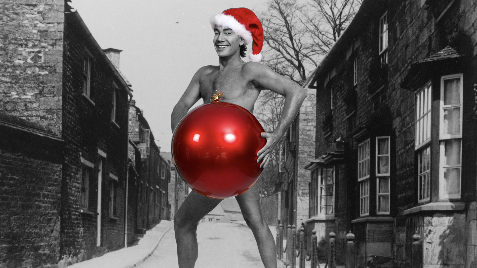 Craig Revel Horwood with a red Santa's hat on and appearing to hold a giant red bauble. He is otherwise naked, and the image appears superimposed on to a black and white image of a Victorian looking lane.