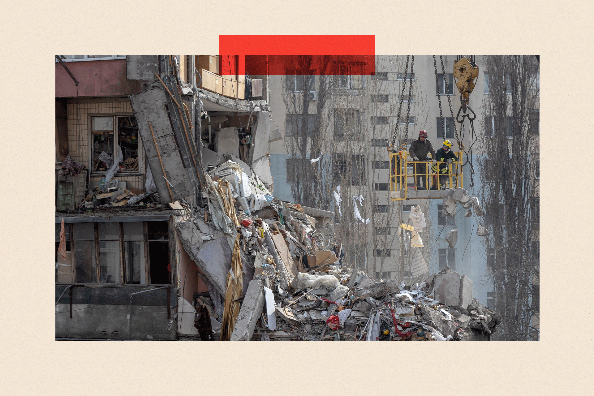 Rescuers clear debris from a multi-story building heavily damaged following a drone strike, in Odesa 
