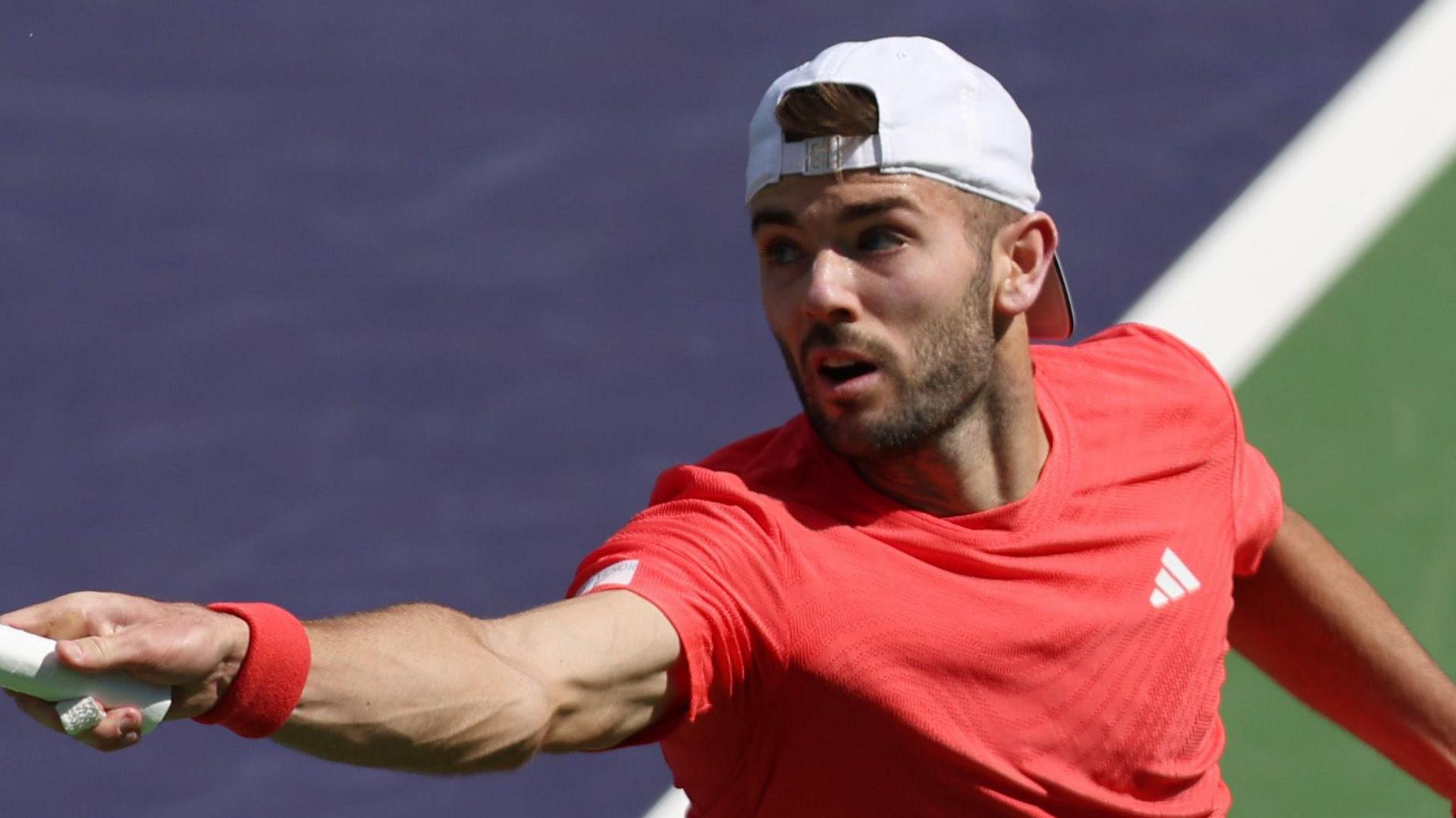 Jacob Fearnley stretches for a forehand return against Joao Fonseca in Indian Wells