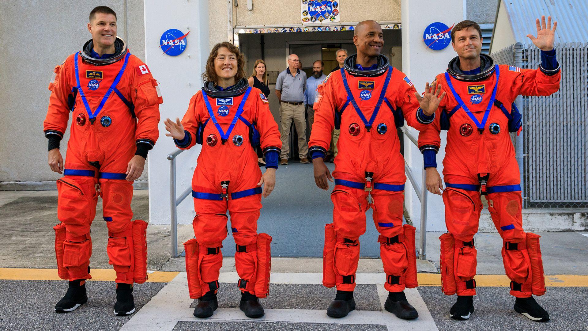 Artemis II crew members (L-R) Jeremy Hansen, Christina Koch, Victor Glover, and Reid Wiseman walk out of Astronaut Crew Quarters to test the crew timeline for launch day.