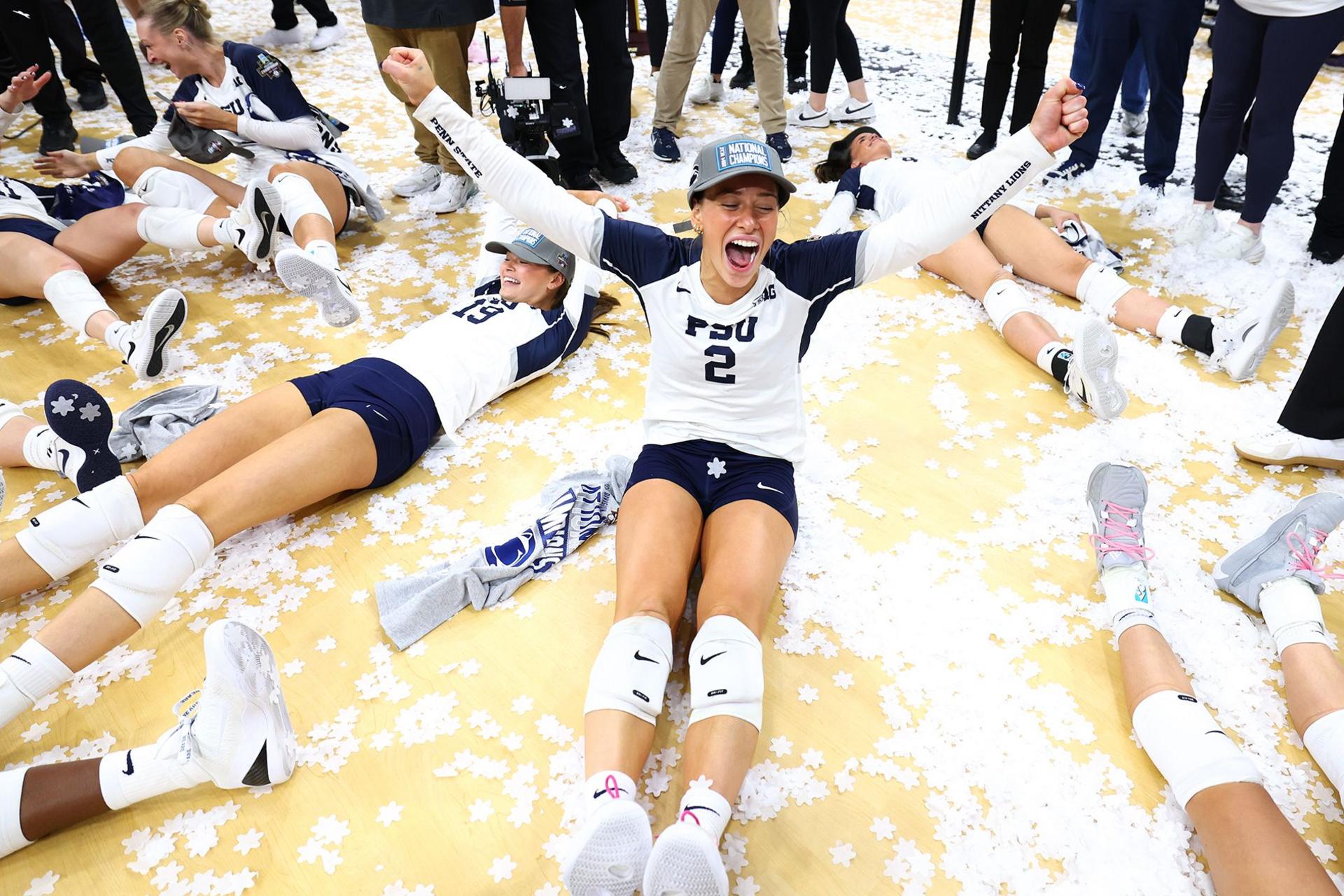 The Penn St. Nittany Lions celebrate after defeating the Louisville Cardinals to win the Division I Women's Volleyball Championship held at the KFC Yum! Center in Louisville, Kentucky