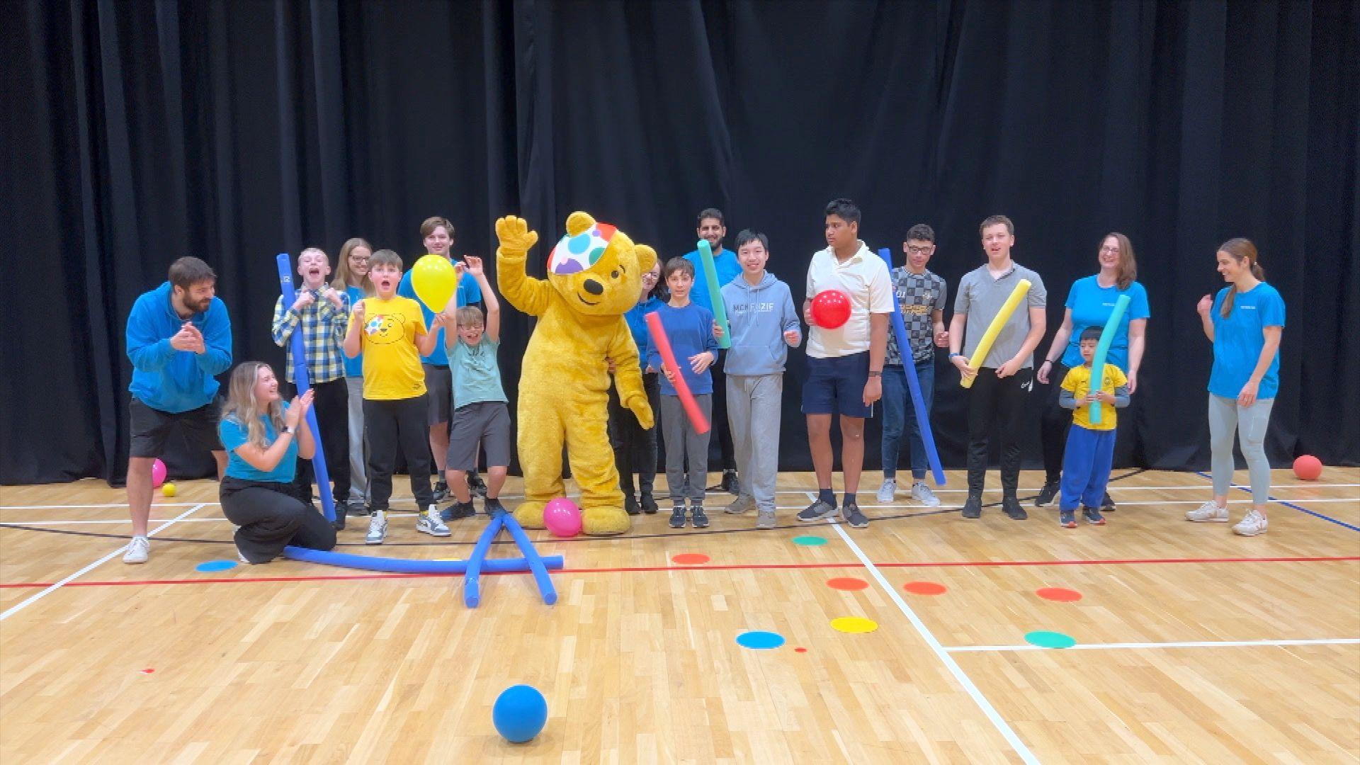 A group photo with Pudsey bear at ASD Family Help